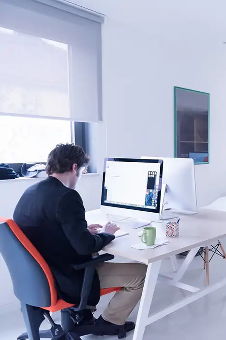 Developer working on office computer