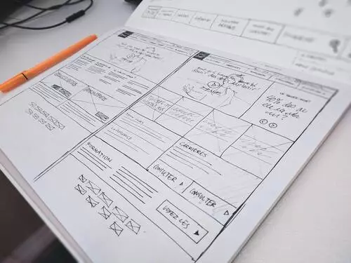 Designer sketching up website pages
